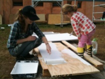 Dani and Gracie painting the bed platform!